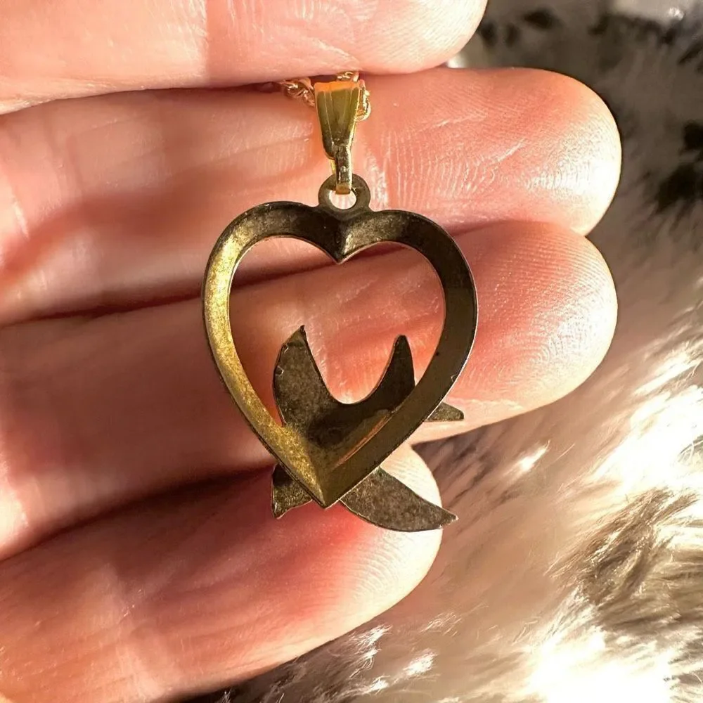 Gold tone heart with faux pearl bird pendant necklace